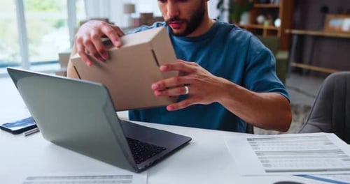 Box, laptop and startup with hands of man in home office for freelance delivery or distribution