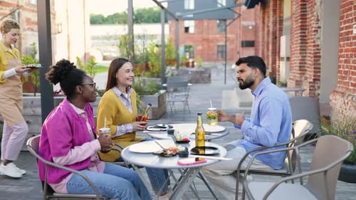 Friends Enjoying Sushi Outdoors