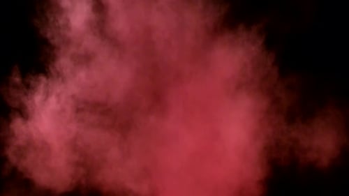 Collider Collection: Red colored powder lingering on a black background