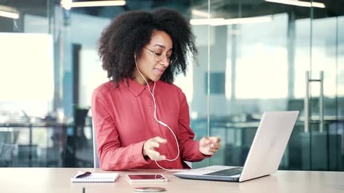 Young Woman on Video Call in Modern Office