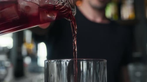 Bartender Pouring Cocktail in Urban Nightclub