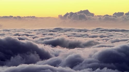 Dramatic Aerial View of Clouds at Golden Hour
