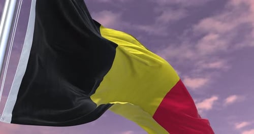 Realistic Waving Belgium Flag Against Cloudy Sky