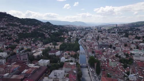 Aerial dolly forward scenic european city Sarajevo old town and river miljacka