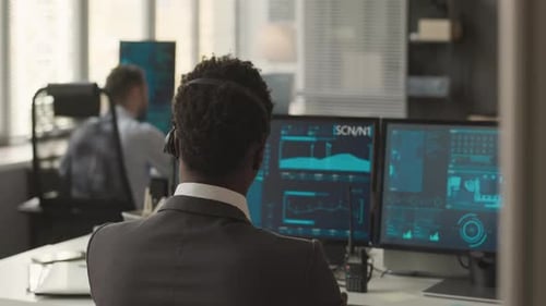 Man Working at Computer in Modern Office