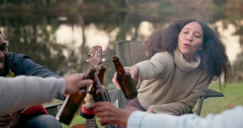 Camping, cheers and friends with alcohol in nature for holiday, vacation and adventure in woods