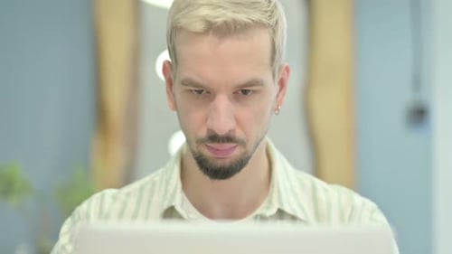 Close Up of Man Typing on Laptop