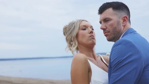 A picture-perfect couple celebrating love on a glowing beach