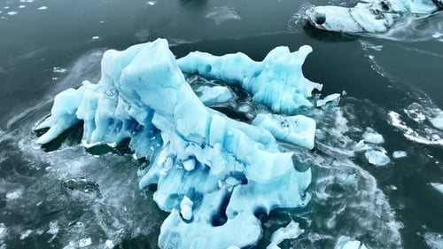 Cinematic Drone View of the Sharp Ice Ridges of Glacier Blue Ice Natural Landscape of the Icelandic