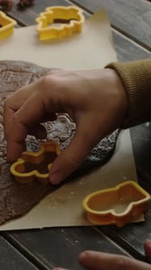 Cutting Festive Christmas Cookies at Home