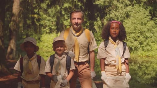 Portrait of Scout Leader with Children in Forest