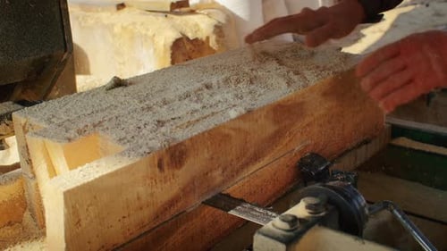 Saw Cuts Lumber at Sawmill in Rural Setting