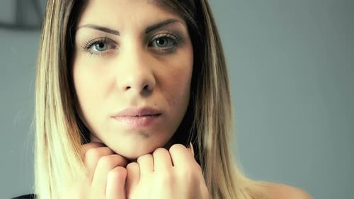 Blonde Woman's Elegant Close-Up Portrait Indoors