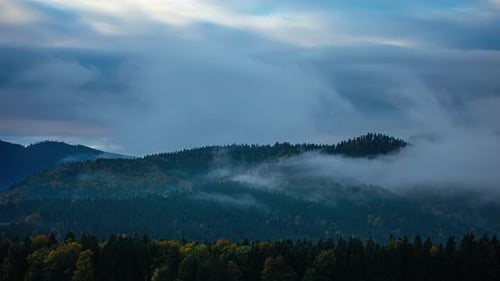 Austrian alps with fog and clouds in the valley - magical time lapse