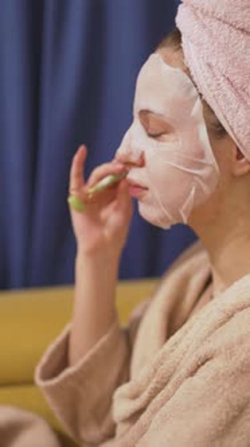 Vertical Relaxing Skincare Routine Woman Applying Face Mask at Home
