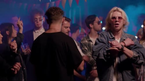 People Dancing in Nightclub with Blue Lighting