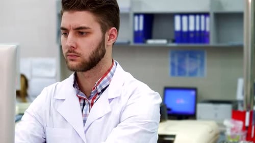 Young Adult Scientist Working at a Computer