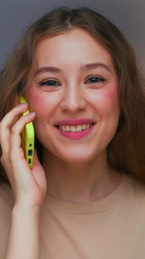 Smiling Woman Talking on Cell Phone