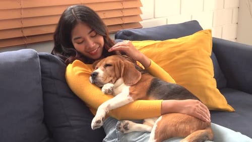 Woman with Dog relaxing her Day at home.