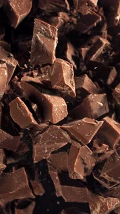 Pieces of Chocolate Fly Up and Fall Down Filmed on a Highspeed Camera at 1000 Fps
