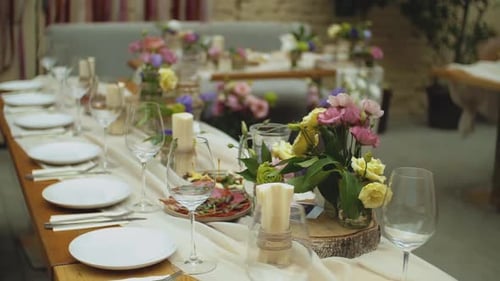 Elegant Wedding Table Setting with Floral Arrangements