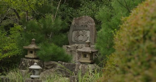 japanese stone sculptures in a forest