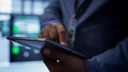 Extreme Close Up Shot of Worker in Server Hub Using Tablet