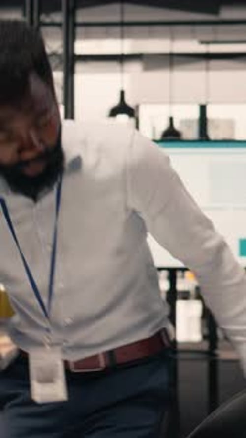 Vertical Video Portrait of Black Businessman Reviewing Data Analysis and Performance Review