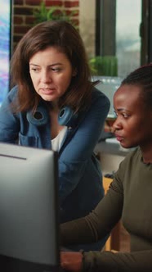 Vertical Video People Doing Teamwork to Develop New Interface in Agency Office