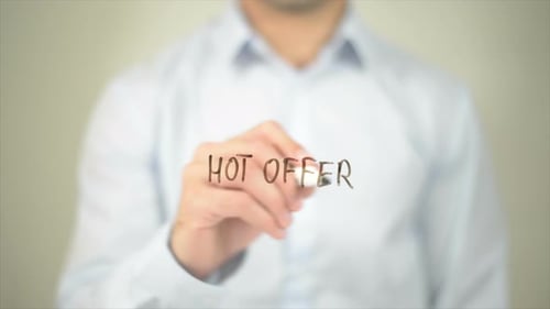 Man Writing Hot Offer with Marker