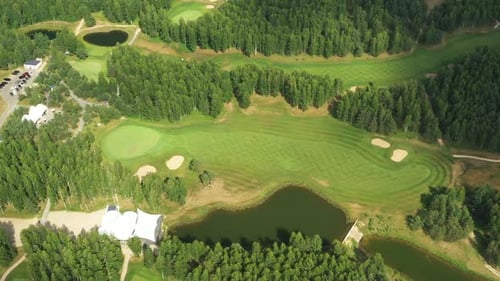 Top View of the Golf Course Located in a Wooded Area