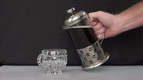 Coffee Pouring into Decorative Glass Mug