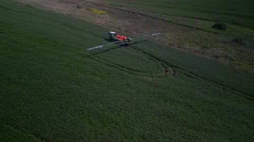 Spray Fertilize On Field With Chemicals In Agriculture Field