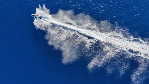 Jet Skis Speeding Across Deep Blue Ocean Waters