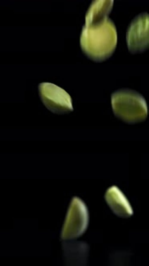 Green Peas Fall on the Table Filmed on a Highspeed Camera at 1000 Fps