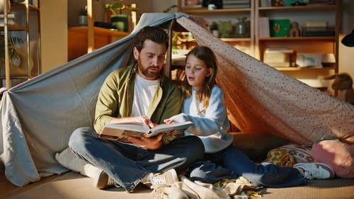 Parent Daughter Flipping Pages Spending Family Weekend Home Blanket Fort