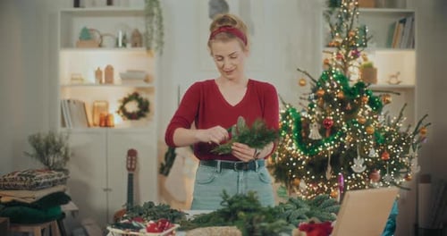 Woman Making Green Fresh Christmas Wreath For Christmas Holidays Florist DIY