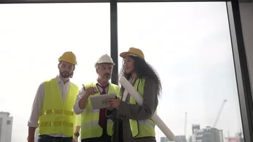 Engineers work in high rise building.