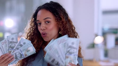 Smiling Woman Holding Fans of Money