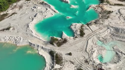 Aerial View of Tin Mining Landscape with Blue Lake Indonesia