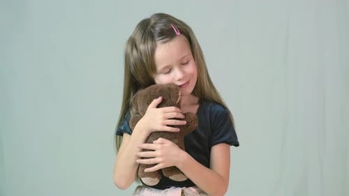 Pretty Child Girl Playing with Her Teddy Bear Toy