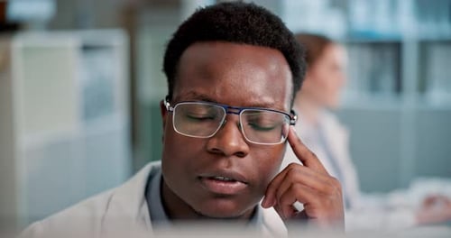 Focused Adult Wearing Glasses in Science Environment