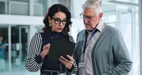 People, employees and explain with tablet at office for research project, website and internet