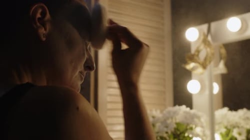 Mime Artist Applying White Powder on Face in Backstage Room