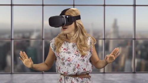 Woman Experiences Virtual Reality with VR Headset