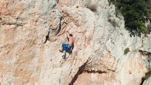 Rock climber climbing the rock 9