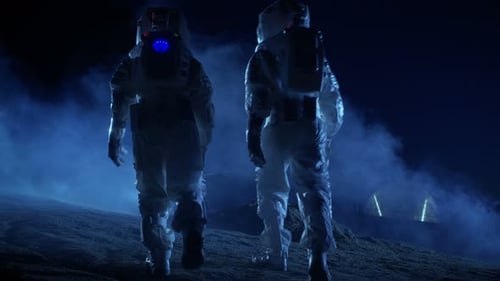 Astronauts Walking on Planet Surface Near Space Rover