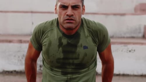Man in Green Tshirt Exercise Sport Triceps on the Step Outdoor