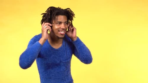 Young Adult Listening to Music Wearing Headphones