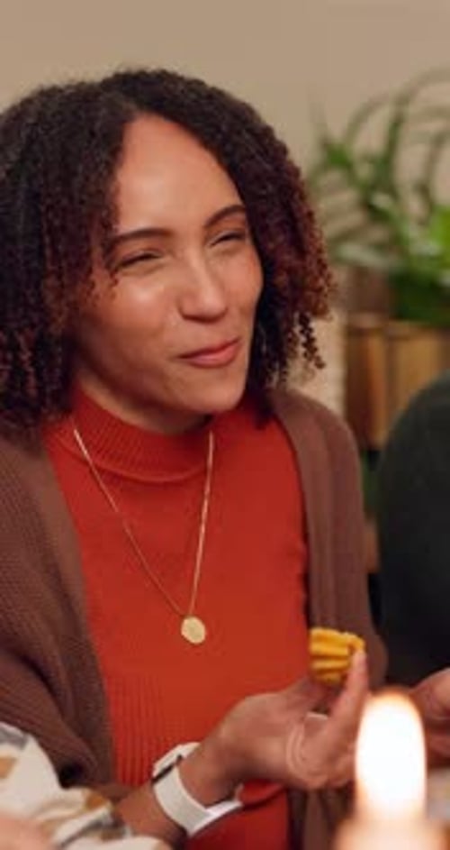 Woman Eating Food at Table Indoors